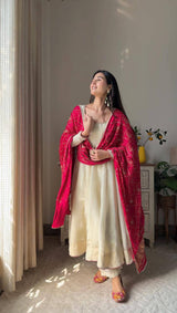 Add elegance to your festive look with this Exclusive 3 Piece Gown Pair crafted in luxurious Chinon fabric. Adorned with golden lace and fine piping