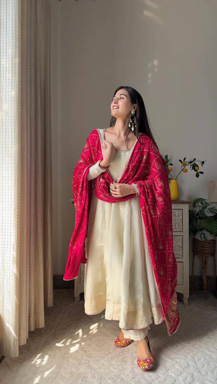 Add elegance to your festive look with this Exclusive 3 Piece Gown Pair crafted in luxurious Chinon fabric. Adorned with golden lace and fine piping