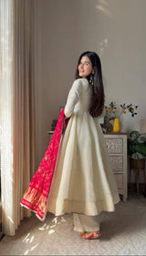 Add elegance to your festive look with this Exclusive 3 Piece Gown Pair crafted in luxurious Chinon fabric. Adorned with golden lace and fine piping