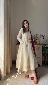 Add elegance to your festive look with this Exclusive 3 Piece Gown Pair crafted in luxurious Chinon fabric. Adorned with golden lace and fine piping